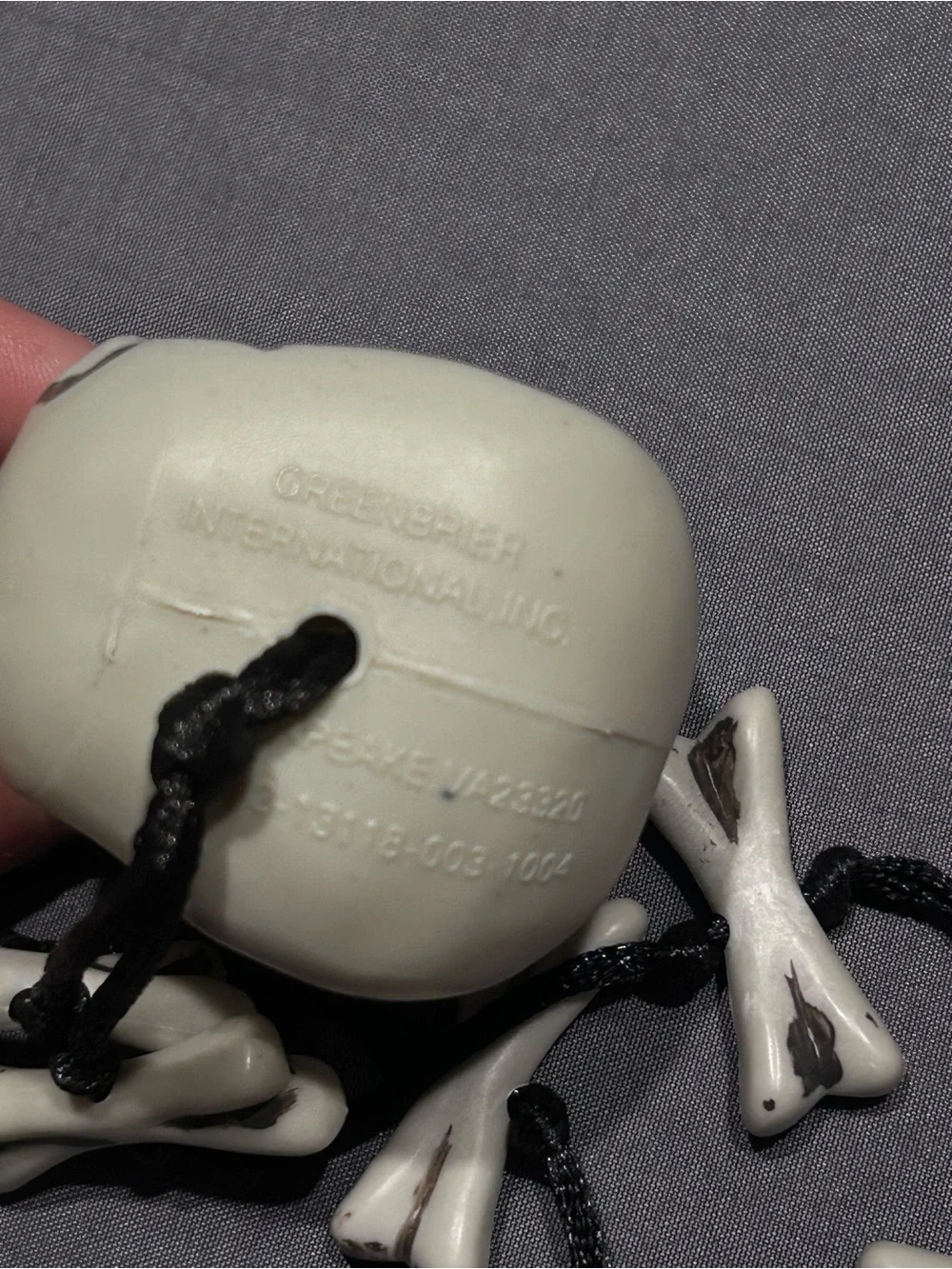 Greenbrier International Plastic Skull and Crossbones Cord Necklace